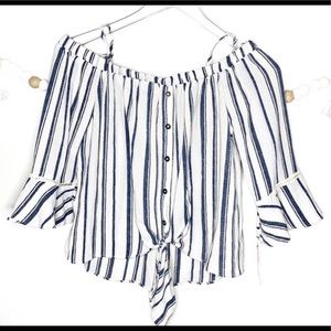 Off the shoulder blue and white stripe shirt.